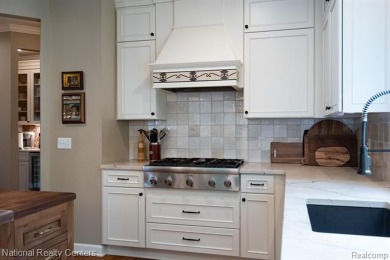 This custom property is tucked away on a quiet cul-de-sac is in on Oakhurst Golf and Country Club in Michigan - for sale on GolfHomes.com, golf home, golf lot