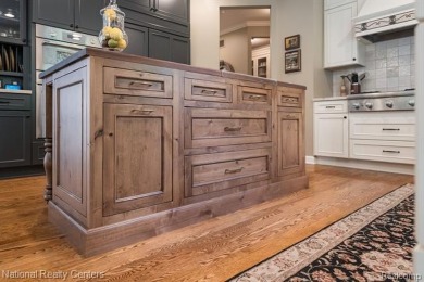 This custom property is tucked away on a quiet cul-de-sac is in on Oakhurst Golf and Country Club in Michigan - for sale on GolfHomes.com, golf home, golf lot