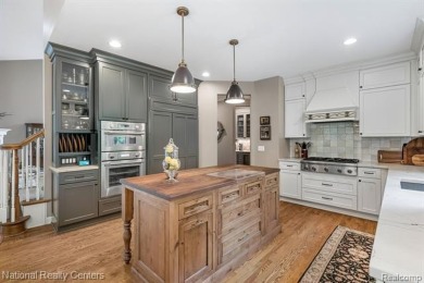 This custom property is tucked away on a quiet cul-de-sac is in on Oakhurst Golf and Country Club in Michigan - for sale on GolfHomes.com, golf home, golf lot
