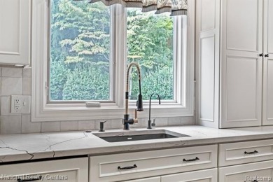 This custom property is tucked away on a quiet cul-de-sac is in on Oakhurst Golf and Country Club in Michigan - for sale on GolfHomes.com, golf home, golf lot