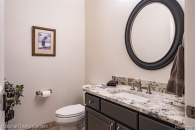 This custom property is tucked away on a quiet cul-de-sac is in on Oakhurst Golf and Country Club in Michigan - for sale on GolfHomes.com, golf home, golf lot