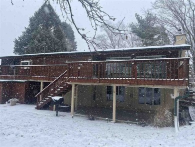 Cozy up to the crackle of the real wood fireplace in this home on Lake McBride Golf Course in Iowa - for sale on GolfHomes.com, golf home, golf lot