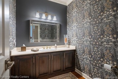 This custom property is tucked away on a quiet cul-de-sac is in on Oakhurst Golf and Country Club in Michigan - for sale on GolfHomes.com, golf home, golf lot