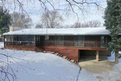 Cozy up to the crackle of the real wood fireplace in this home on Lake McBride Golf Course in Iowa - for sale on GolfHomes.com, golf home, golf lot