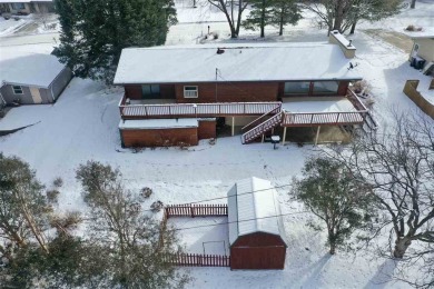 Cozy up to the crackle of the real wood fireplace in this home on Lake McBride Golf Course in Iowa - for sale on GolfHomes.com, golf home, golf lot