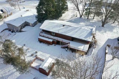 Cozy up to the crackle of the real wood fireplace in this home on Lake McBride Golf Course in Iowa - for sale on GolfHomes.com, golf home, golf lot