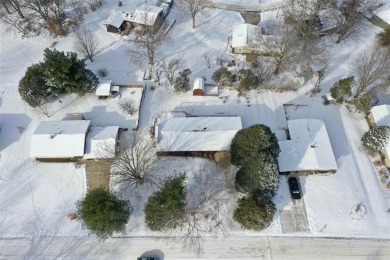 Cozy up to the crackle of the real wood fireplace in this home on Lake McBride Golf Course in Iowa - for sale on GolfHomes.com, golf home, golf lot