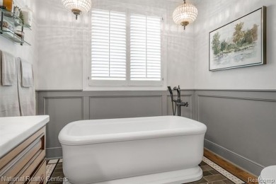 This custom property is tucked away on a quiet cul-de-sac is in on Oakhurst Golf and Country Club in Michigan - for sale on GolfHomes.com, golf home, golf lot