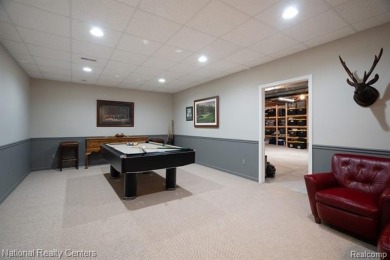 This custom property is tucked away on a quiet cul-de-sac is in on Oakhurst Golf and Country Club in Michigan - for sale on GolfHomes.com, golf home, golf lot