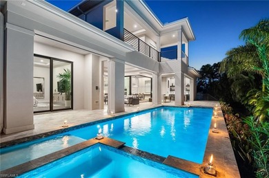 Contemporary coastal architecture with clean, modern lines is on The Moorings Country Club in Florida - for sale on GolfHomes.com, golf home, golf lot