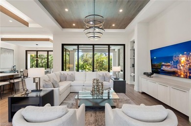 Contemporary coastal architecture with clean, modern lines is on The Moorings Country Club in Florida - for sale on GolfHomes.com, golf home, golf lot
