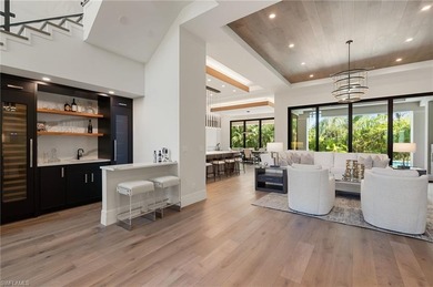 Contemporary coastal architecture with clean, modern lines is on The Moorings Country Club in Florida - for sale on GolfHomes.com, golf home, golf lot