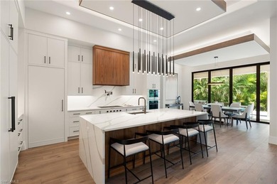 Contemporary coastal architecture with clean, modern lines is on The Moorings Country Club in Florida - for sale on GolfHomes.com, golf home, golf lot