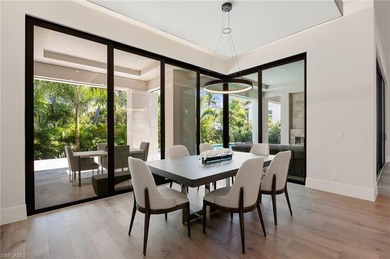 Contemporary coastal architecture with clean, modern lines is on The Moorings Country Club in Florida - for sale on GolfHomes.com, golf home, golf lot