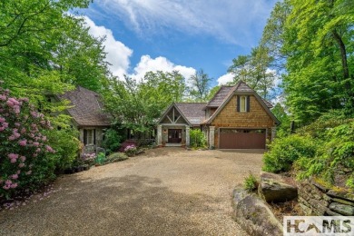 Situated on a large lot, prominently overlooking the 10th golf on Wade Hampton Golf Club in North Carolina - for sale on GolfHomes.com, golf home, golf lot