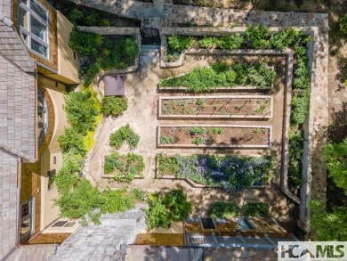 Situated on a large lot, prominently overlooking the 10th golf on Wade Hampton Golf Club in North Carolina - for sale on GolfHomes.com, golf home, golf lot