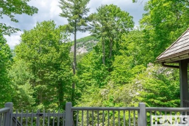 Situated on a large lot, prominently overlooking the 10th golf on Wade Hampton Golf Club in North Carolina - for sale on GolfHomes.com, golf home, golf lot