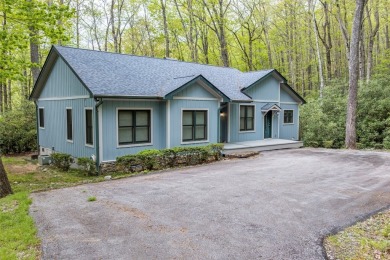 Nestled in the popular Holly Forest community of Sapphire, this on Sapphire National Golf Club in North Carolina - for sale on GolfHomes.com, golf home, golf lot