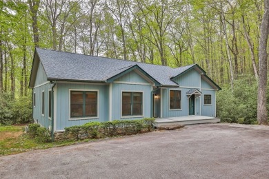Nestled in the popular Holly Forest community of Sapphire, this on Sapphire National Golf Club in North Carolina - for sale on GolfHomes.com, golf home, golf lot