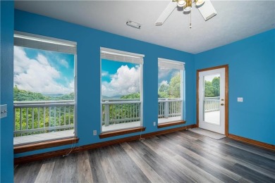 Stunning Home with Ozark Mountain Views - Across from Golf on Holiday Island Golf Course in Arkansas - for sale on GolfHomes.com, golf home, golf lot