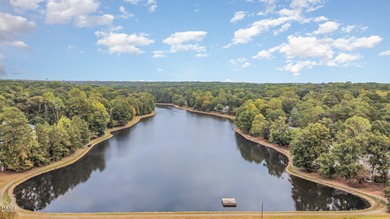 WATERFRONT property on Loch Lomond in Lochmere's Windsong on Lochmere Golf Club in North Carolina - for sale on GolfHomes.com, golf home, golf lot