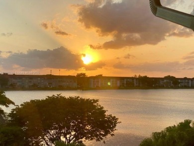 ENJOY STUNNING LAKE VIEWS from your balcony! This LARGEST CORNER on Flamingo Lakes Country Club in Florida - for sale on GolfHomes.com, golf home, golf lot