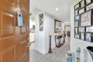 ENJOY STUNNING LAKE VIEWS from your balcony! This LARGEST CORNER on Flamingo Lakes Country Club in Florida - for sale on GolfHomes.com, golf home, golf lot