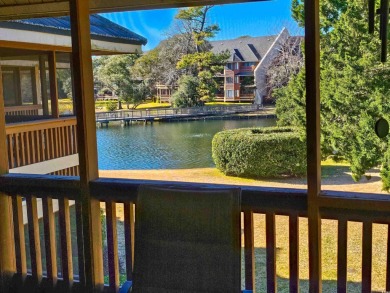 Beautiful lake view from this large screened-in porch that has on Arcadian Shores Golf Club in South Carolina - for sale on GolfHomes.com, golf home, golf lot