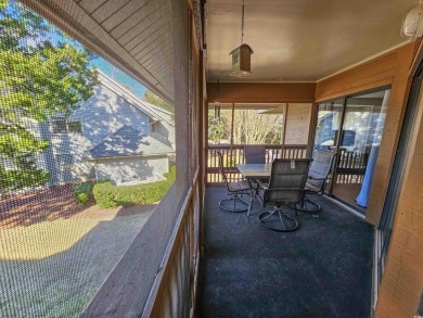 Beautiful lake view from this large screened-in porch that has on Arcadian Shores Golf Club in South Carolina - for sale on GolfHomes.com, golf home, golf lot