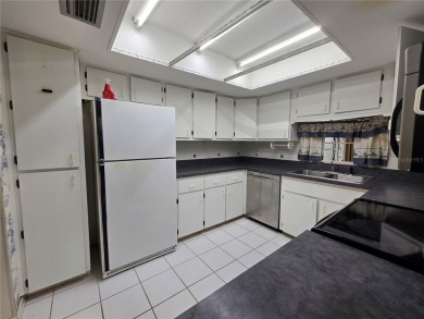 2nd floor condo located in the 55+ community of Live Oak Village on Country Club At Silver Springs Shores in Florida - for sale on GolfHomes.com, golf home, golf lot