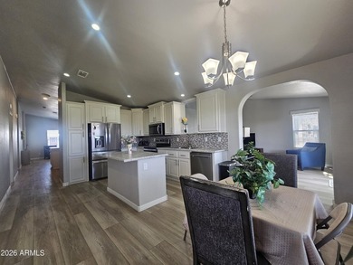 Experience luxury living in this spacious triple-wide home on Viewpoint Golf Resort in Arizona - for sale on GolfHomes.com, golf home, golf lot