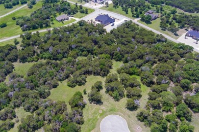 Imagine your dream home tucked within the trees on this over an on The Retreat in Texas - for sale on GolfHomes.com, golf home, golf lot