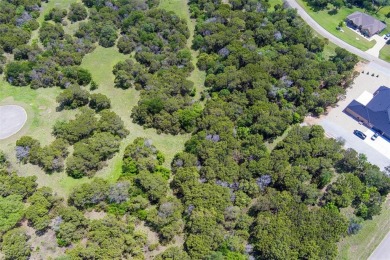 Imagine your dream home tucked within the trees on this over an on The Retreat in Texas - for sale on GolfHomes.com, golf home, golf lot