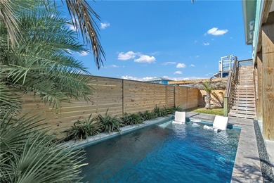 This 4-bedroom, 3-bathroom home is just a short golf cart ride on Palmilla Beach Golf Club in Texas - for sale on GolfHomes.com, golf home, golf lot