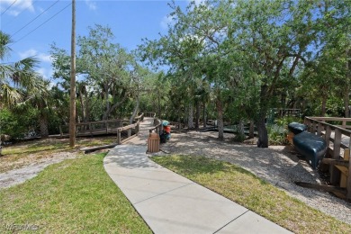 Welcome to this beautifully remodeled 2-bedroom + den, 1st-floor on Shadow Wood Preserve in Florida - for sale on GolfHomes.com, golf home, golf lot