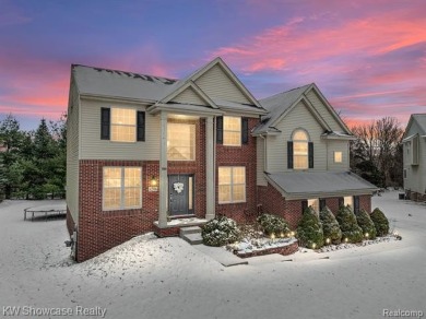 Nestled in the heart of Commerce Township, this grand 4-bedroom on Union Lake Golf Course in Michigan - for sale on GolfHomes.com, golf home, golf lot