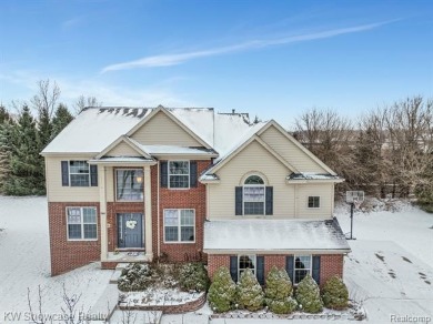 Nestled in the heart of Commerce Township, this grand 4-bedroom on Union Lake Golf Course in Michigan - for sale on GolfHomes.com, golf home, golf lot