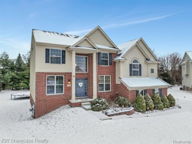 Nestled in the heart of Commerce Township, this grand 4-bedroom on Union Lake Golf Course in Michigan - for sale on GolfHomes.com, golf home, golf lot