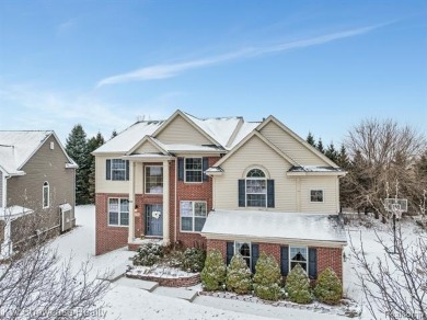 Nestled in the heart of Commerce Township, this grand 4-bedroom on Union Lake Golf Course in Michigan - for sale on GolfHomes.com, golf home, golf lot