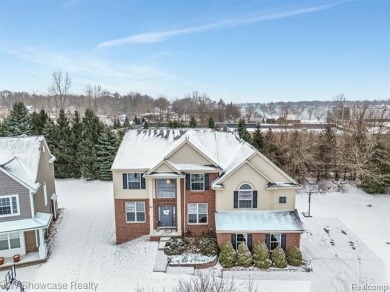 Nestled in the heart of Commerce Township, this grand 4-bedroom on Union Lake Golf Course in Michigan - for sale on GolfHomes.com, golf home, golf lot