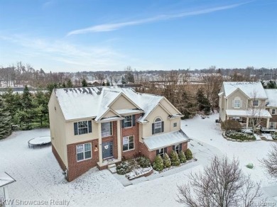 Nestled in the heart of Commerce Township, this grand 4-bedroom on Union Lake Golf Course in Michigan - for sale on GolfHomes.com, golf home, golf lot