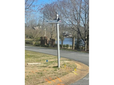 This wooded 1/2 acre lot is located in Ford's Colony. A gentle on Fords Colony Country Club At Williamsburg in Virginia - for sale on GolfHomes.com, golf home, golf lot
