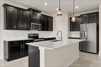 **This property qualifies for a closing cost credit up to $5,700 on ChampionsGate Golf Resort in Florida - for sale on GolfHomes.com, golf home, golf lot