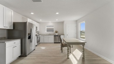 Welcome to the Freeport Plan, a new home floor plan at Sunny on Sunny Hills Golf and Country Club in Florida - for sale on GolfHomes.com, golf home, golf lot