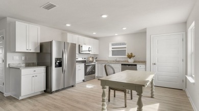 Welcome to the Freeport Plan, a new home floor plan at Sunny on Sunny Hills Golf and Country Club in Florida - for sale on GolfHomes.com, golf home, golf lot