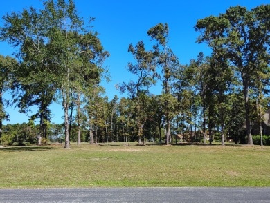 Premium recently cleared custom building lot on the 15th tee box on Players Course At Wyboo Plantation in South Carolina - for sale on GolfHomes.com, golf home, golf lot