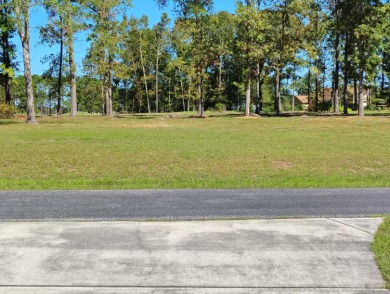 Premium recently cleared custom building lot on the 15th tee box on Players Course At Wyboo Plantation in South Carolina - for sale on GolfHomes.com, golf home, golf lot
