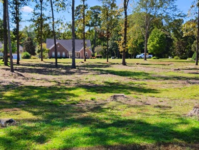 Premium recently cleared custom building lot on the 15th tee box on Players Course At Wyboo Plantation in South Carolina - for sale on GolfHomes.com, golf home, golf lot