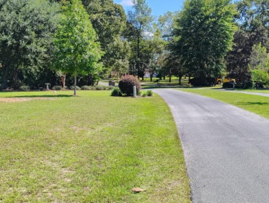 Premium recently cleared custom building lot on the 15th tee box on Players Course At Wyboo Plantation in South Carolina - for sale on GolfHomes.com, golf home, golf lot