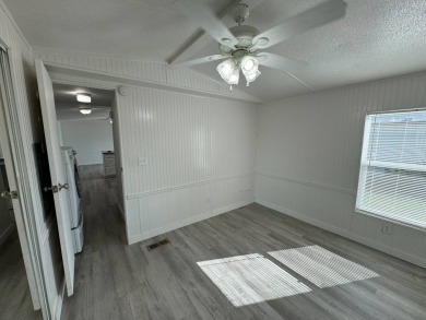 Time to buy is now! This beautiful, totally renovated 2/1.5 bath on Lake Henry Golf Club in Florida - for sale on GolfHomes.com, golf home, golf lot